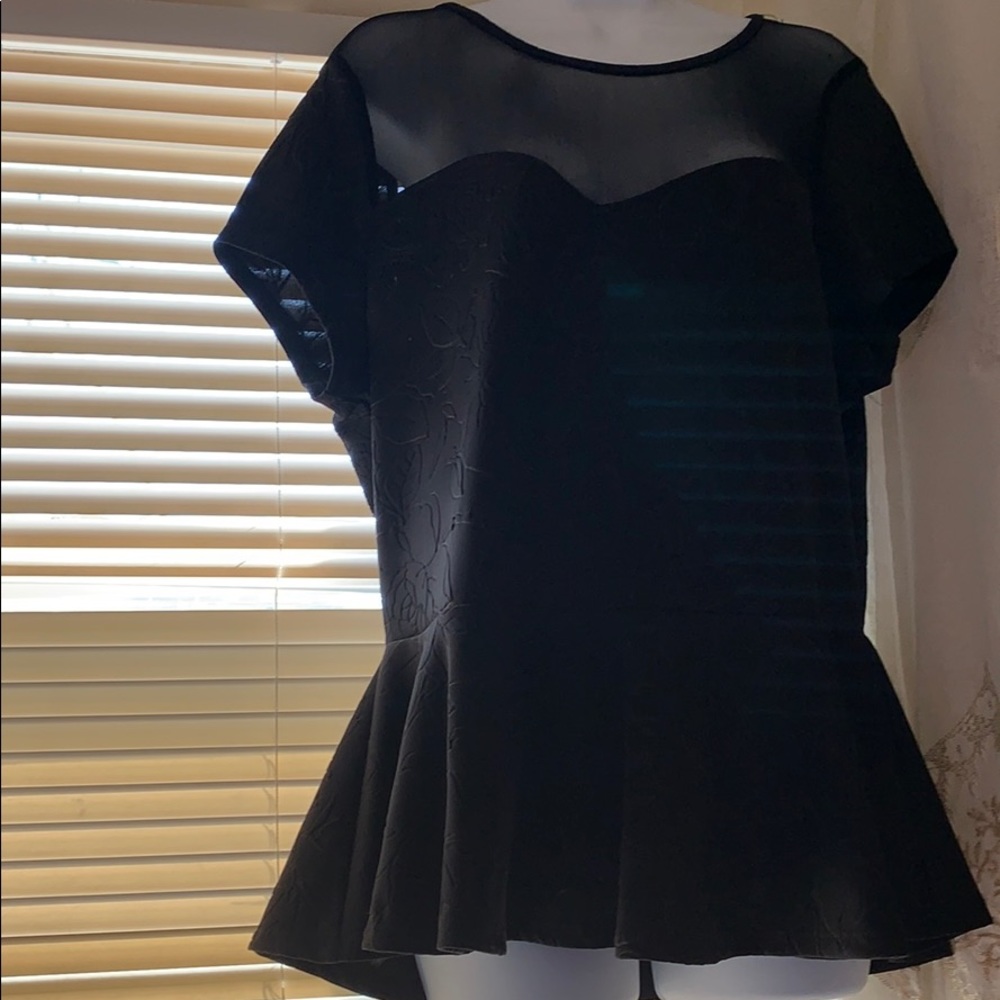 Women black peplum blouse.